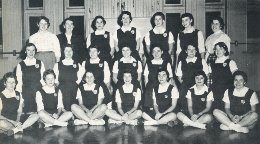 A black and white photo from the 1956 women's hockey team.